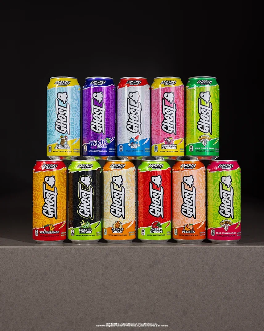 Stacked cans of GHOST® ENERGY in ten flavors
