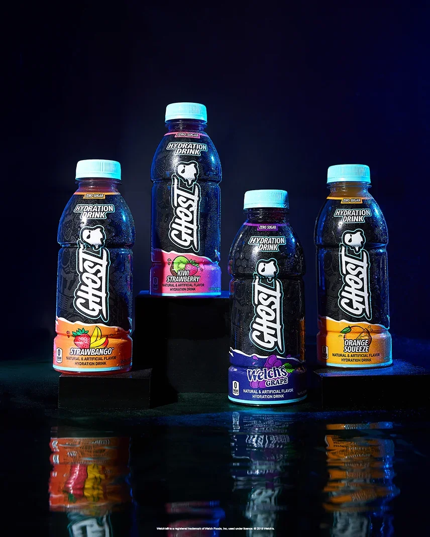 Bottles of GHOST® HYDRATION under blue light
