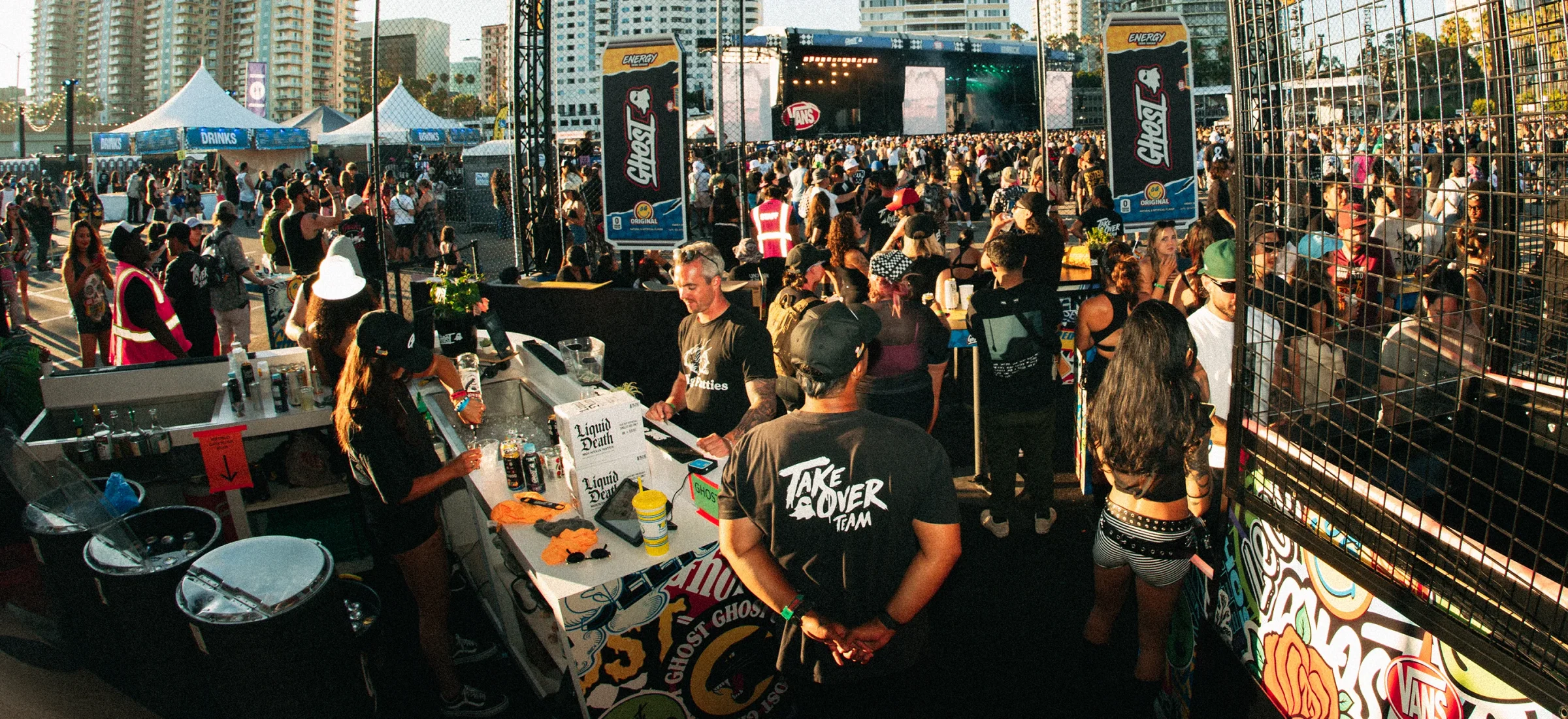Festival crowd around the GHOST® Takeover stage at sunset